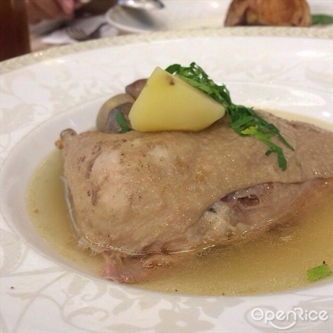 slow stewed chicken in broth with potato and onion