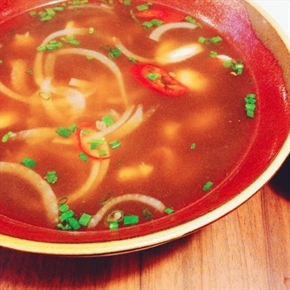 Pho and fresh sliced prawns in clear chicken soup